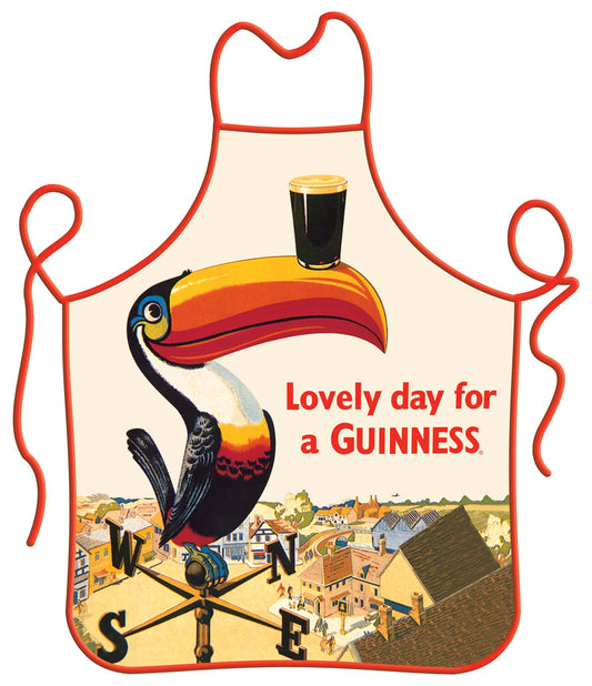 Vintage Guinness Toucan Apron featuring a toucan with a pint of beer on its beak, above a stylized town scene, with the text "Lovely day for a Guinness.