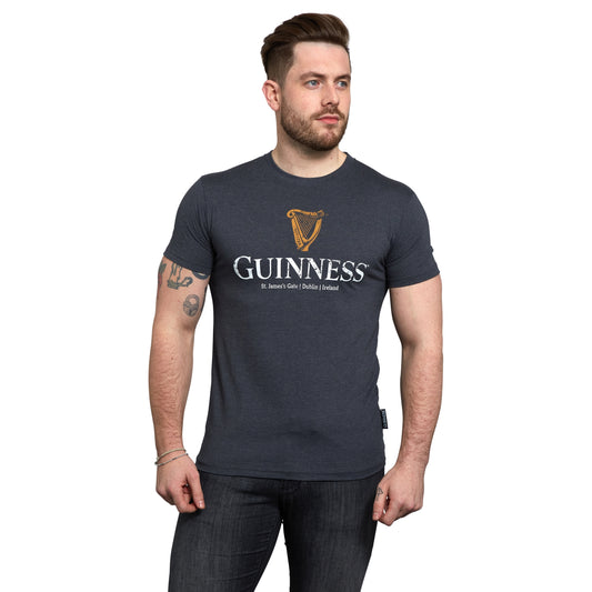 A man wearing a Guinness Navy Distressed Harp Tee.