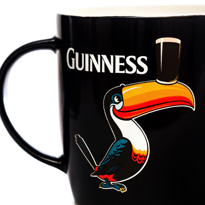 A Guinness Black Mug with Standing Toucan.