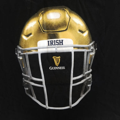 A Guinness Notre Dame Helmet T-Shirt Black, reminiscent of the Guinness Helmet, stands out against a black background.
