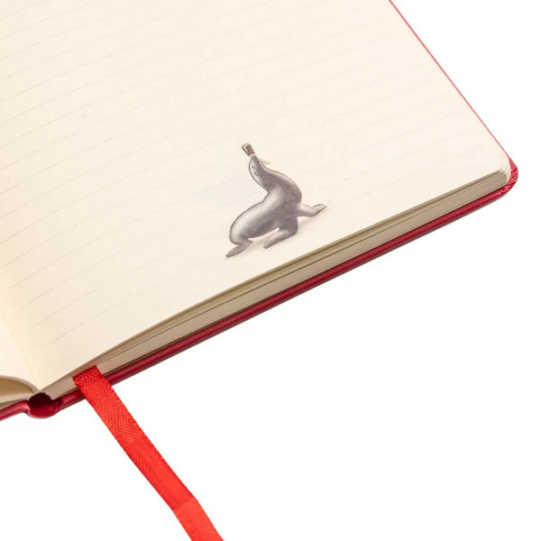 Guinness US A5 notebook with lined pages and a red bookmark, featuring a small metal whale-shaped paperclip attached to one page.