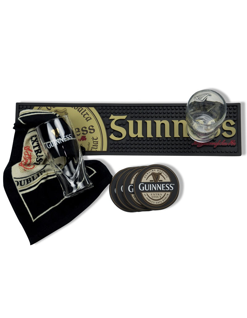 A set of Guinness® Label Bar Towel and Guinness glasses and logo coasters.