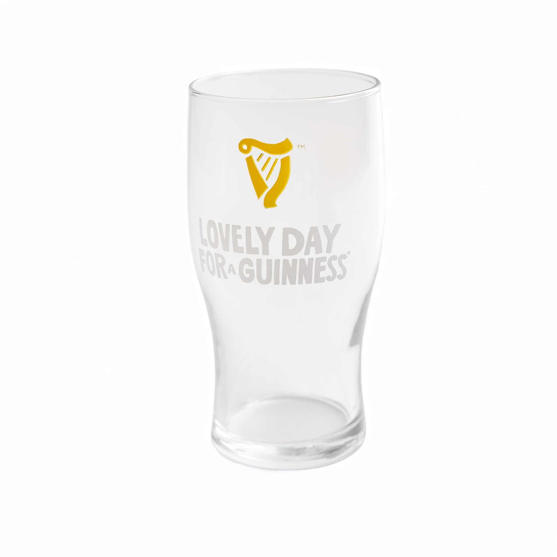 The Guinness Seb Curi Lovely Day Pint Glass from Guinness Webstore US features a yellow harp logo and "Lovely Day for a Guinness" on the front—a perfect collector’s piece for fans.