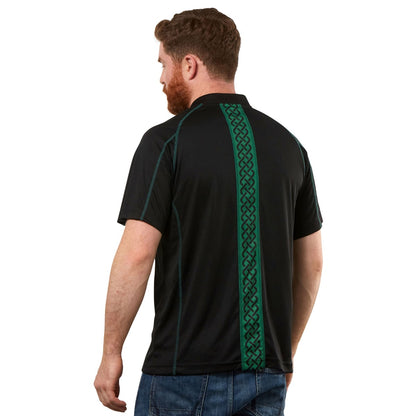 The back view of a man wearing a Guinness Black & Green Short Sleeve Rugby Jersey.