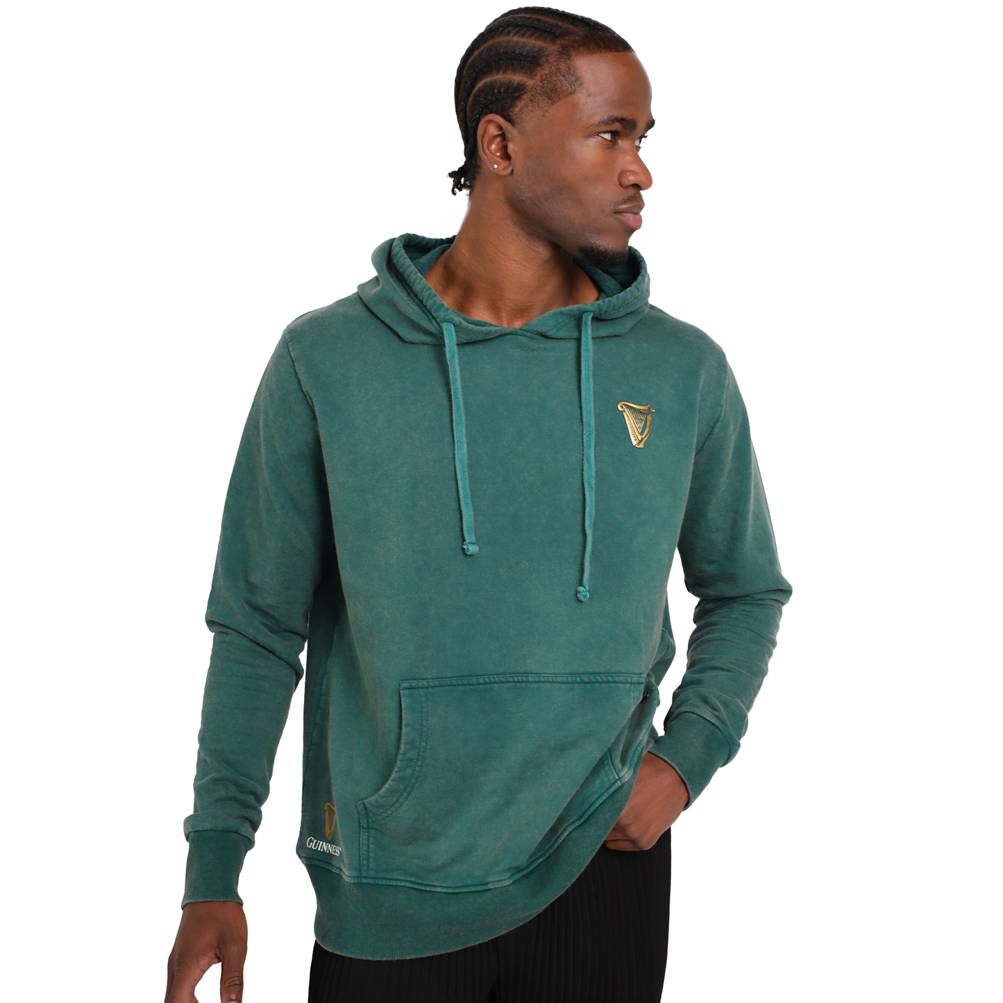 A man wearing a Guinness Forest Green & Gold Toucan Hoodie, exuding both comfort and style.