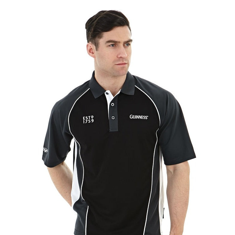 A man wearing a Guinness Performance Golf Shirt polo shirt.