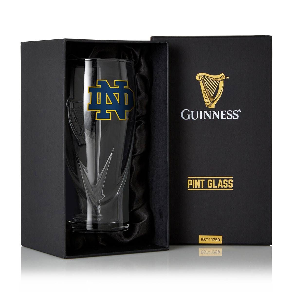 A Guinness Notre Dame 16OZ Pint Glass in a box.