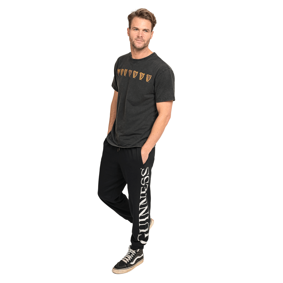 A man wearing comfortable Guinness joggers made of organic cotton.
