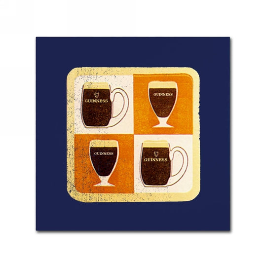 Four Guinness mugs on a Guinness Brewery 'Guinness II' Canvas Art of blue background.