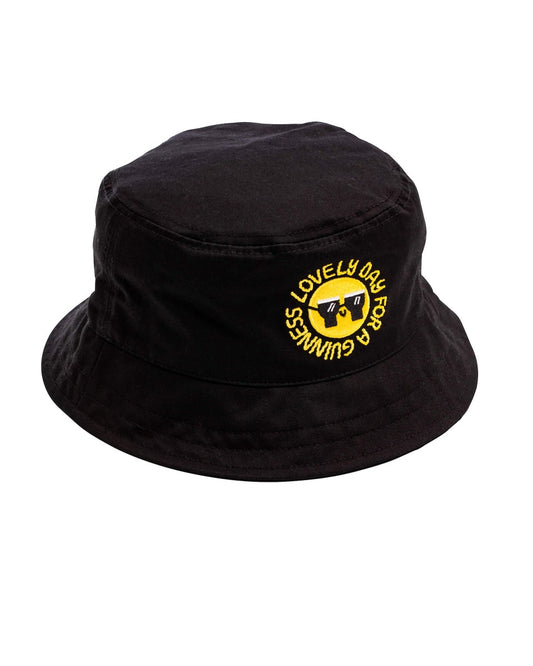 A unique FATTI BURKE "LOVELY DAY FOR A GUINNESS" bucket hat with a yellow Guinness logo, perfect for the summer months.
