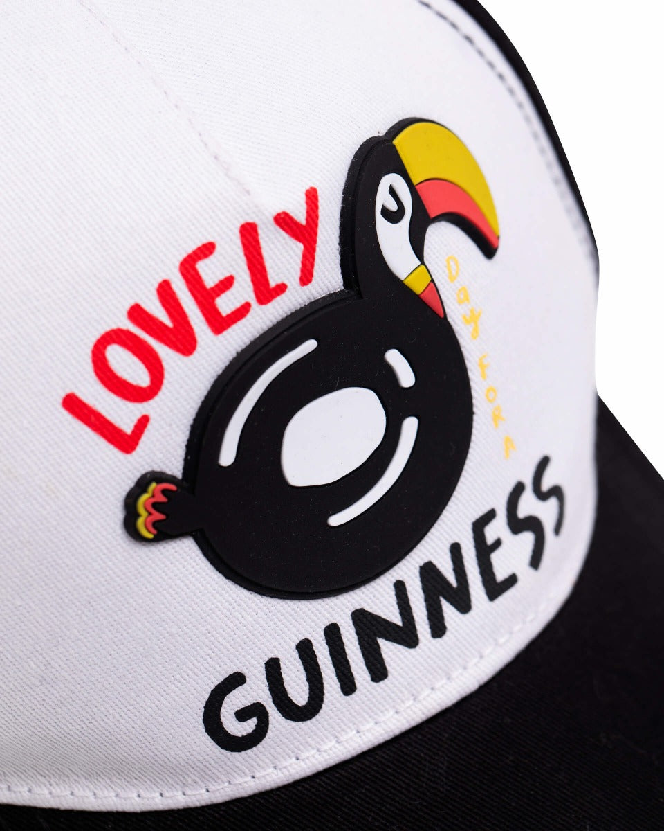 A summer-style baseball cap with a FATTI BURKE "LOVELY DAY FOR A GUINNESS" TOUCAN BASEBALL CAP by Guinness.