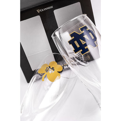 A pair of Guinness Notre Dame-themed glasses with a shamrock.