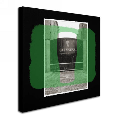 A legacy Guinness Brewery 'Guinness XIV' canvas art featuring a black and green photo of Guinness on a wall.