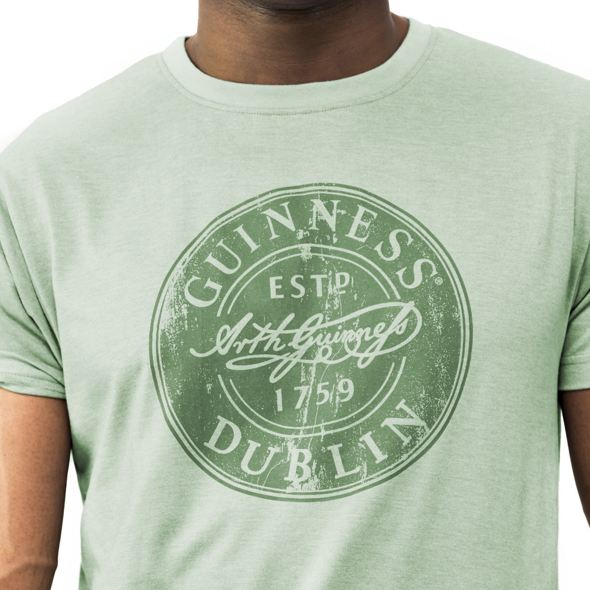 Get your hands on the vibrant Guinness Green Bottle Cap Tee from Guinness. This Dublin-inspired t-shirt, made with a comfortable cotton blend fabric, showcases the iconic Guinness logo. Perfect for any Guinness enthusiast or lover.