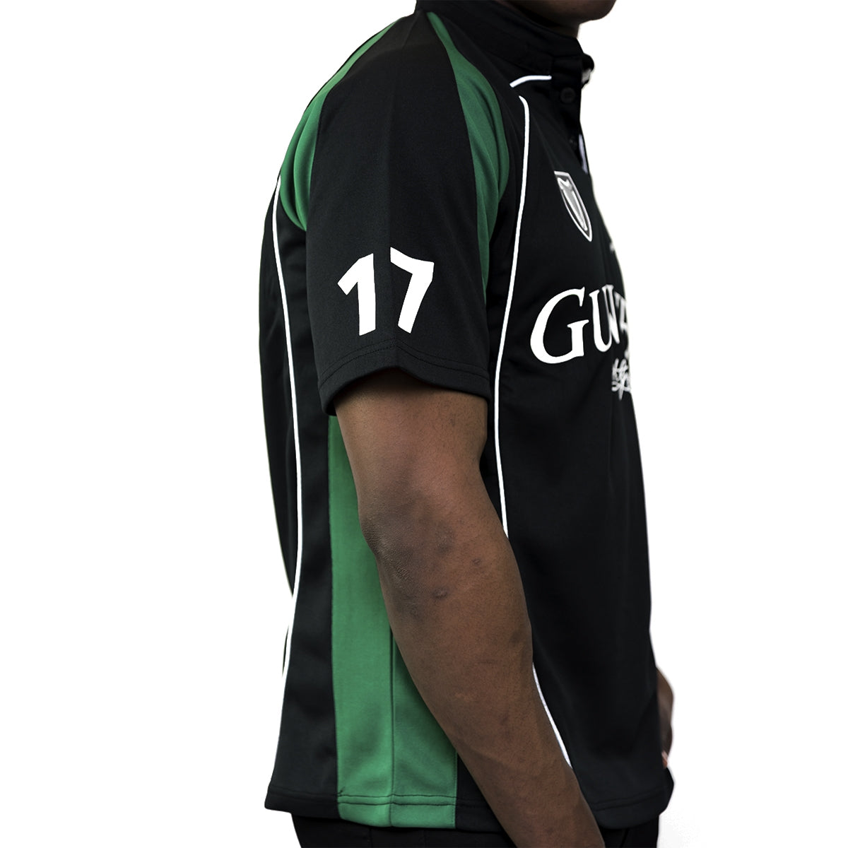 A man wearing a Guinness Short Sleeve Performance Rugby Jersey.