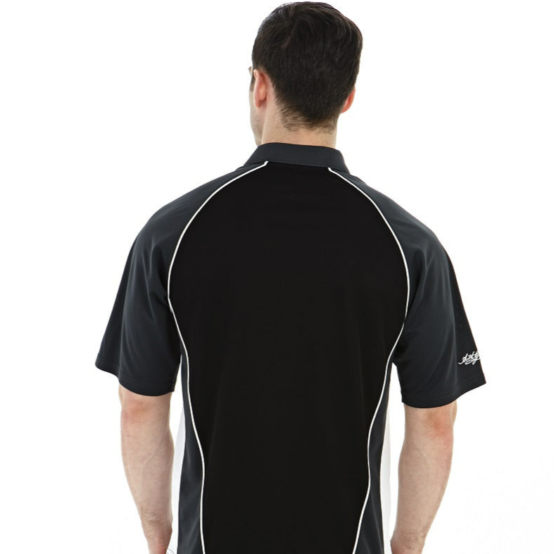 A person with short dark hair, wearing a black Guinness Performance Golf Shirt with white piping, stands with their back to the camera.