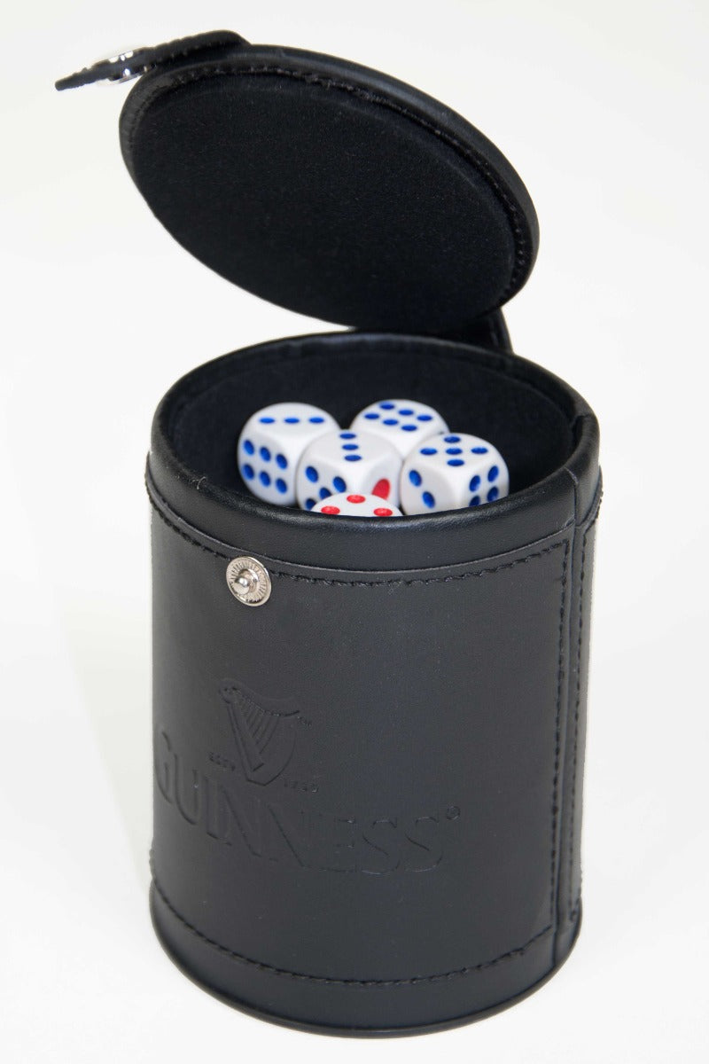 A Guinness® Dice Cup Set perfect for game night, comes in a sleek black leather dice box with three dice included.