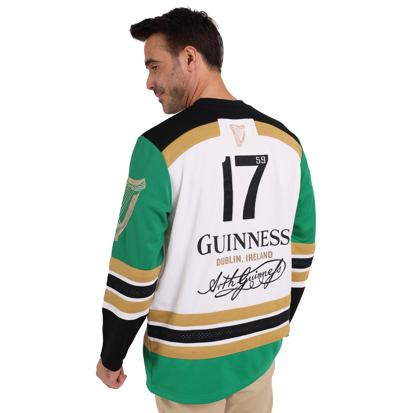 A man wearing a sustainable Guinness Toucan Hockey Jersey made from recycled polyester, featuring the iconic Guinness Toucan graphic.