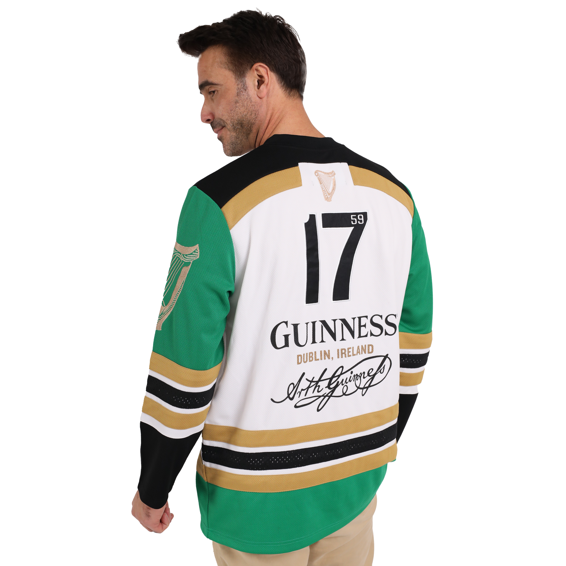 A man wearing a sustainable Guinness Toucan Hockey Jersey made from recycled polyester, featuring the iconic Guinness Toucan graphic.