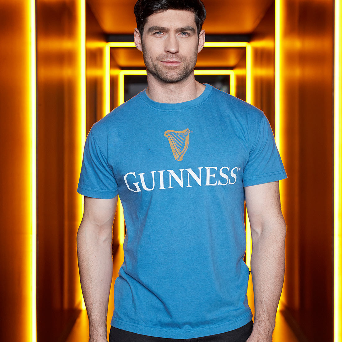 Guinness Trademark Label Blue T-Shirt featuring the Guinness brand.