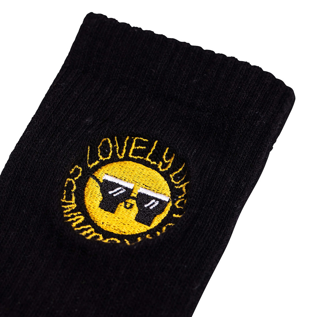A stylish and comfortable FATTI BURKE "LOVELY DAY FOR A GUINNESS" black sock with a smiley face on it.