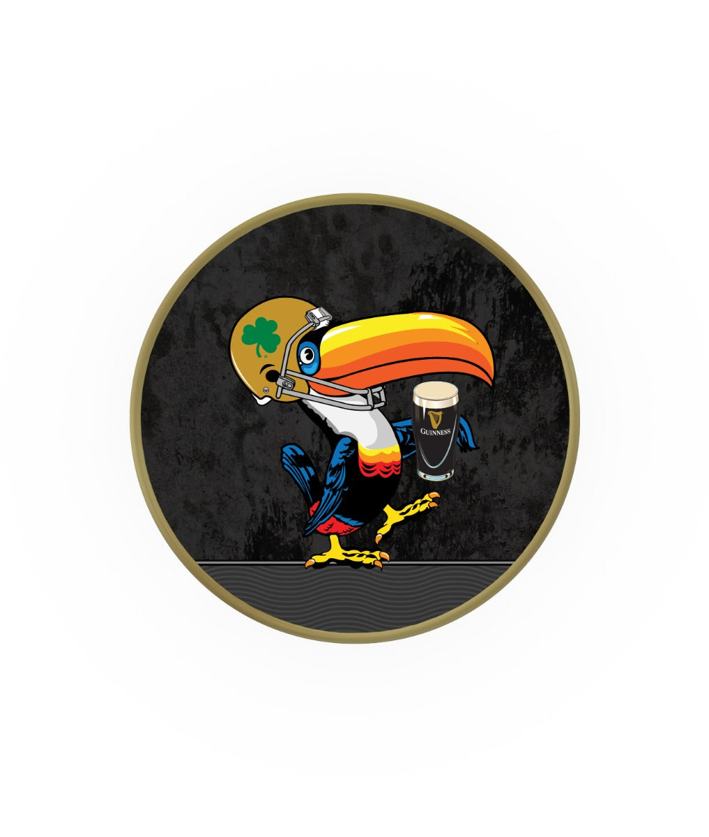 A colorful cartoon toucan enjoying a Notre Dame Toucan Swivel Bar Stool with Gold Trimming beer by Guinness.