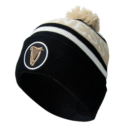 A warm and cozy Guinness Black and White Premium beanie with a harp on it.