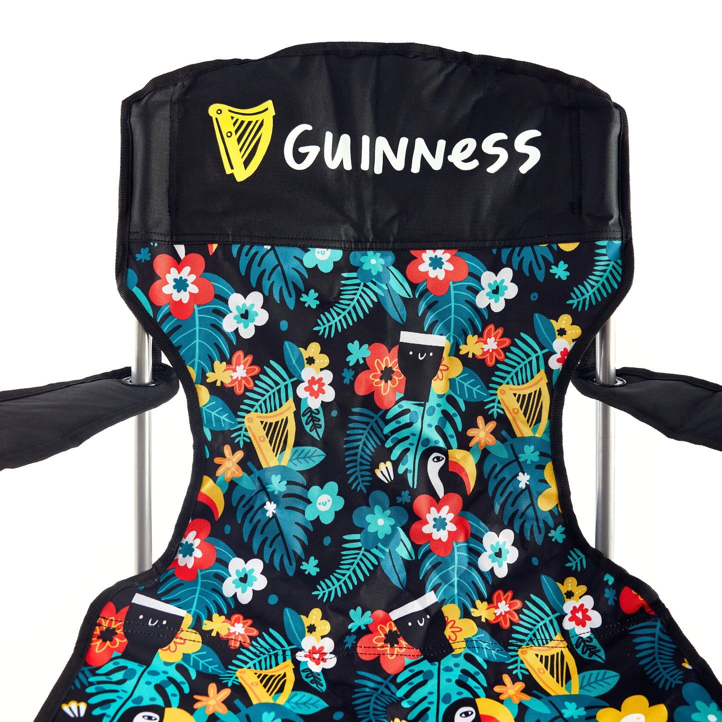 The Guinness x Fatti Burke Hawaiian Camping Chair by Guinness features a vibrant floral and bird pattern with the Guinness logo and harp on the headrest—ideal to pair with your favorite Guinness beach towel for outdoor fun.