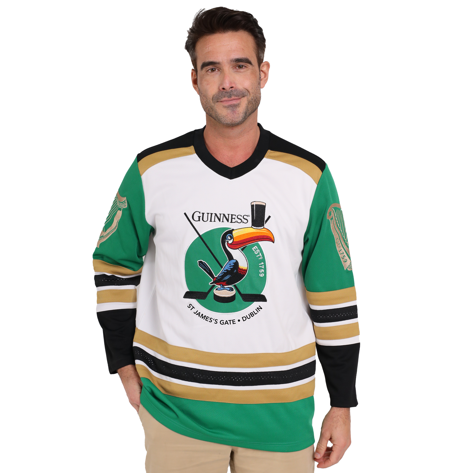 A man donning a Guinness hockey jersey made from sustainable materials and featuring the iconic Guinness Toucan graphic.