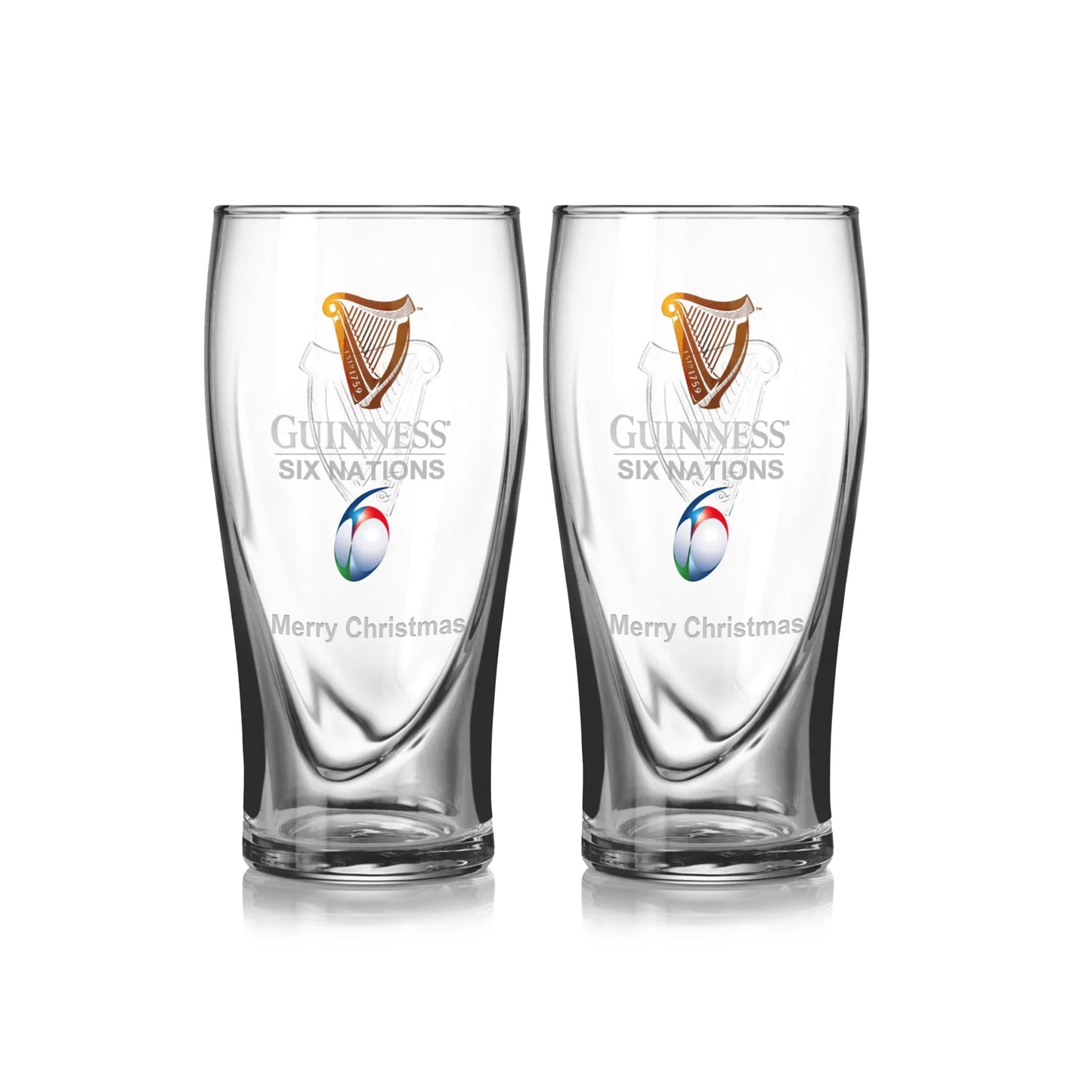 The Guinness Six Nations Pint Glass - 2 Pack from Guinness Webstore US features two clear pint glasses with the "Guinness Six Nations" logo, a rugby ball graphic, and "Merry Christmas" etched—ideal for rugby fans this holiday season.