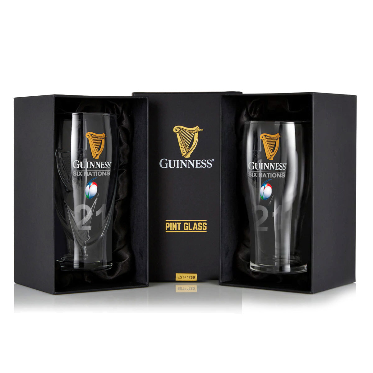 The Guinness Six Nations Pint Glass - 2 Pack from Guinness Webstore US features two rugby-logo pint glasses displayed upright in black presentation boxes with a central GUINNESS pint glass label between them.