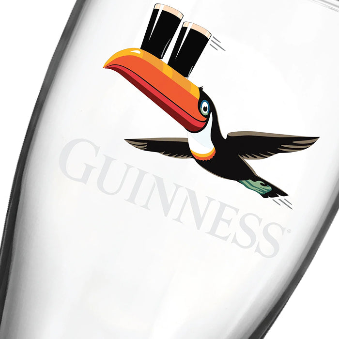 The Guinness Toucan Glass & Pouring Spoon Gift Set features a clear pint glass with the classic toucan and logo—ideal for any Guinness fan.