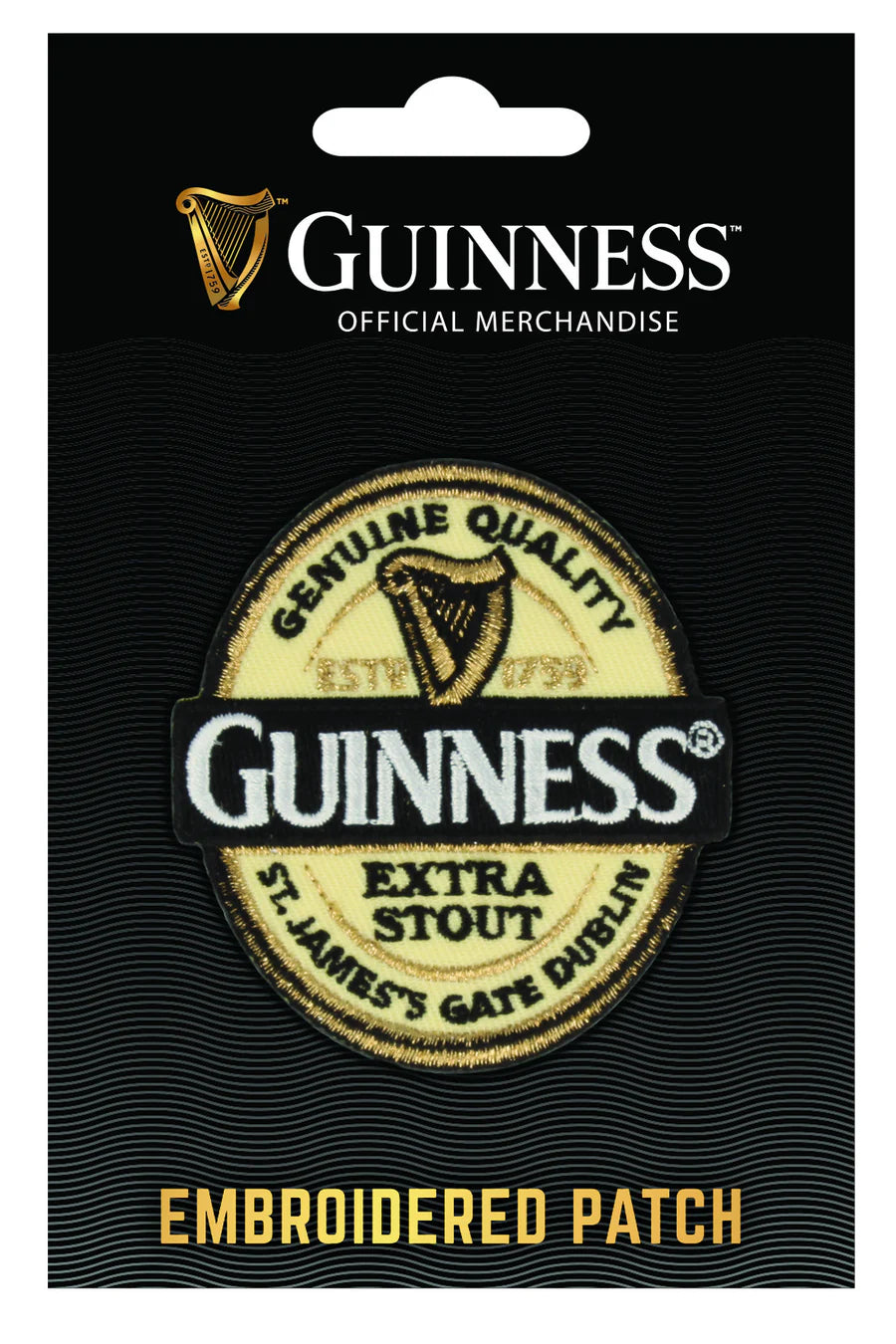 The Guinness Embroidered Patch - Label from Guinness Webstore US features the iconic bottle label design with embroidered logo and "Genuine Quality Extra Stout St. James's Gate Dublin" on official merchandise packaging.