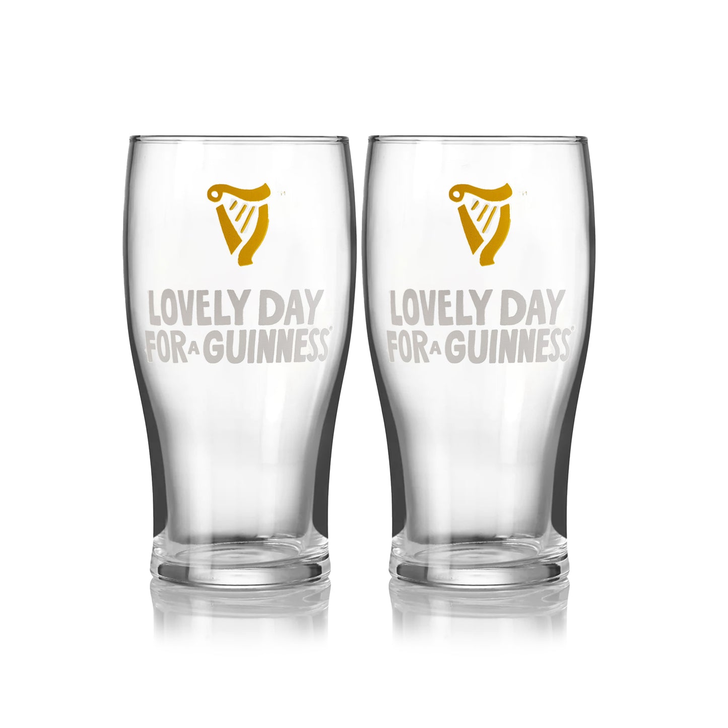 The Guinness Seb Curi Lovely Day Pint Glass 2 Pack from Guinness Webstore US features two collector’s edition pint glasses with the harp logo and "Lovely Day for a Guinness," inspired by Sebastian Curi, shown side by side on a white background.