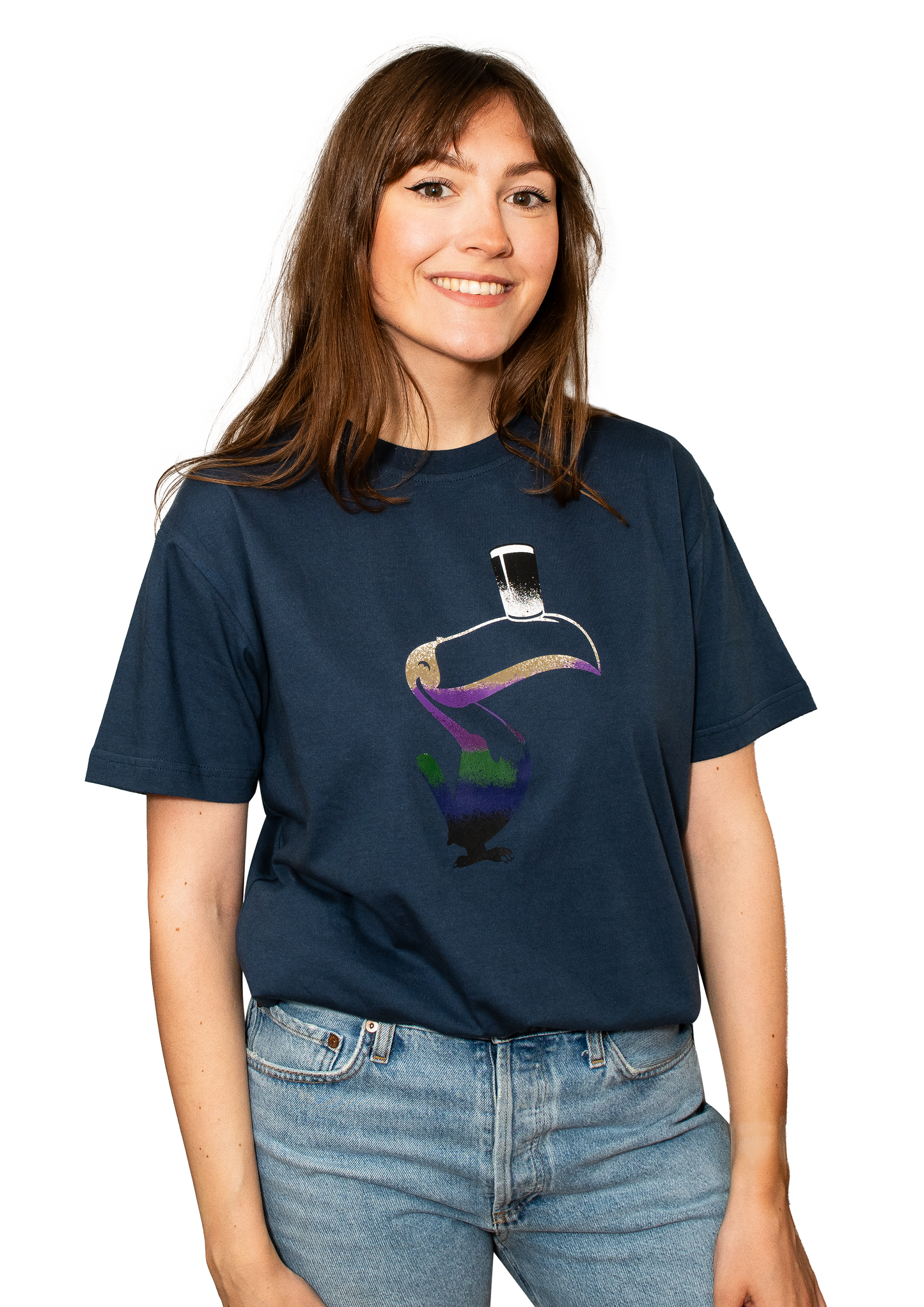 A person wears a Guinness Liquid Toucan Tee - Blue, designed with BCI cotton, showcasing a vibrant Liquid Toucan graphic that enlivens the navy blue fabric.