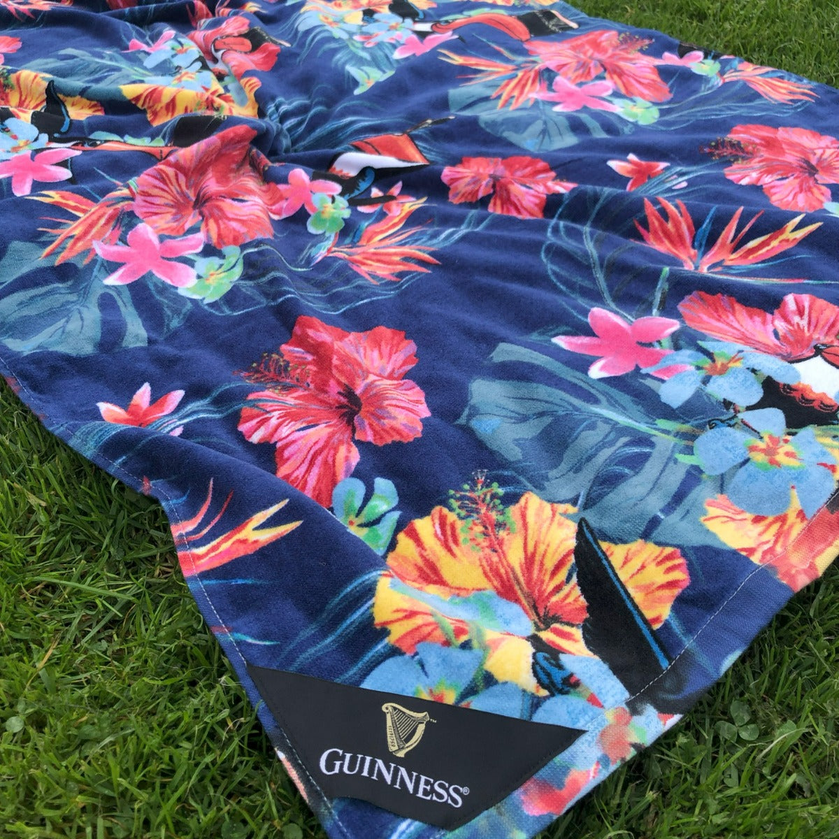 Guinness Toucan Hawaiian beach towel featuring a vibrant Hawaiian pattern.