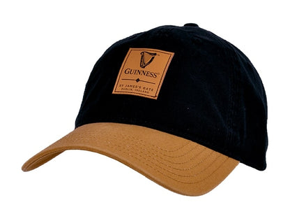 A cotton Guinness Black & Caramel Cap with Leather Patch with the Guinness logo on it.
