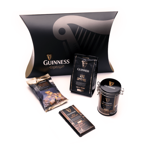 A luxurious Guinness Indulgence Gift Box that includes indulgent chocolates and features a striking harp motif, perfect for any Guinness aficionado.