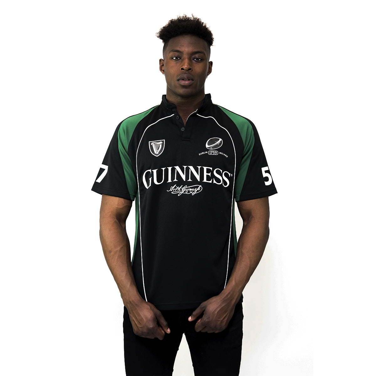A man wearing a Guinness Short Sleeve Performance Rugby Jersey.