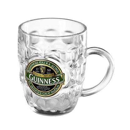 A green glass Guinness beer mug on a white background. (revised)
A green glass Guinness Hobnail Tankard on a white background.
