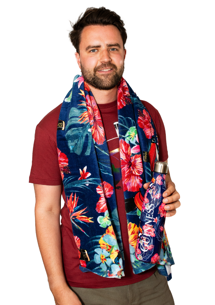 A man wearing a Guinness Toucan Hawaiian Beach Towel holding a water bottle.