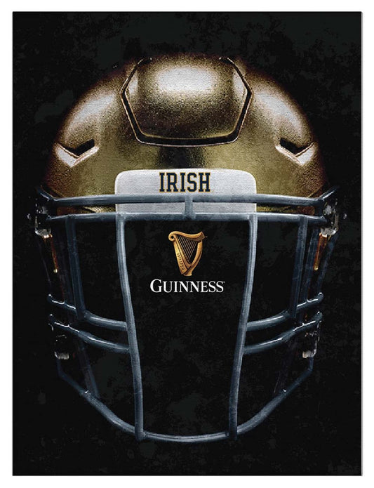 A Guinness Notre Dame helmet, made in the USA, displayed on a black background.