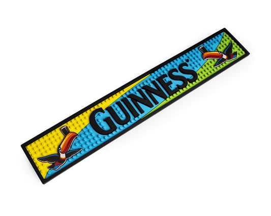 Guinness Toucan PVC Bar Mat with parrots on a white bar mat.