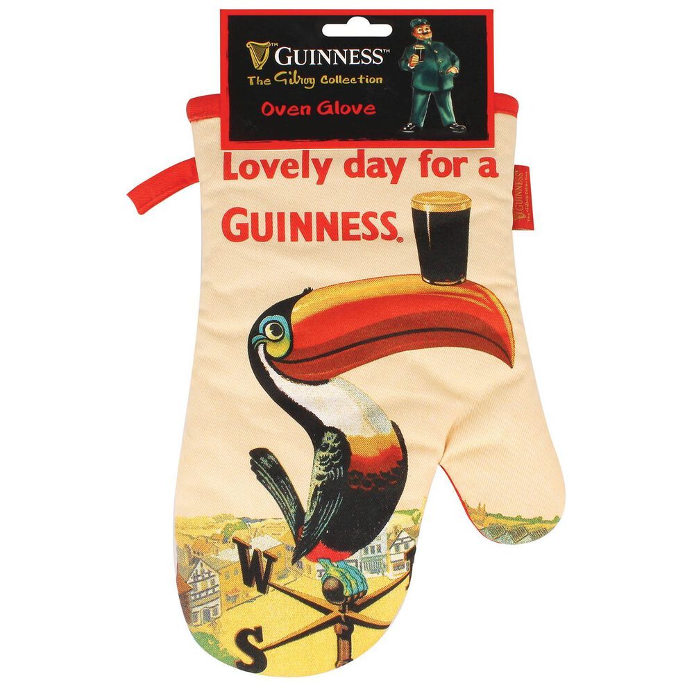 The Guinness Nostalgic Toucan Oven Glove showcases a delightful vintage design with a toucan expertly balancing a pint of Guinness on its beak, featuring the iconic phrase, "Lovely day for a Guinness.