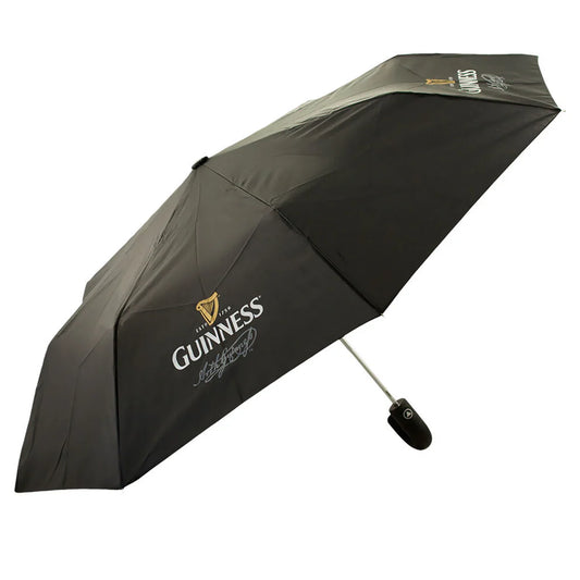 The Guinness Travel Umbrella features the iconic Guinness logo and harp, with a sturdy black handle and metal shaft—perfect as a windproof travel umbrella for any fan.