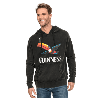 A man sporting a Guinness Premium Label Toucan Hoodie.