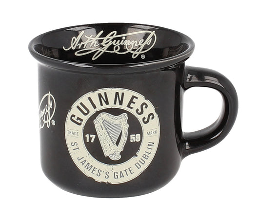 The Guinness Toucan Back Espresso Cup from Guinness Webstore US is a charming black mug, adorned with the iconic harp logo and "St. James's Gate Dublin" text. It captures the essence of Irish craftsmanship, enhancing each coffee moment with authenticity and elegance.