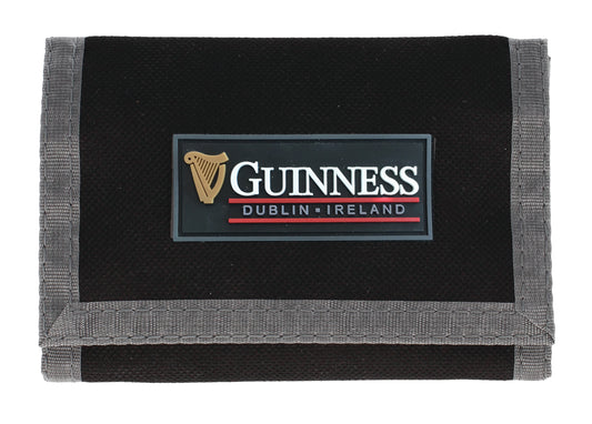 The Guinness Webstore US Sports Wallet features a PVC logo and gray trim—a stylish black wallet perfect for fans and collectors of Guinness.