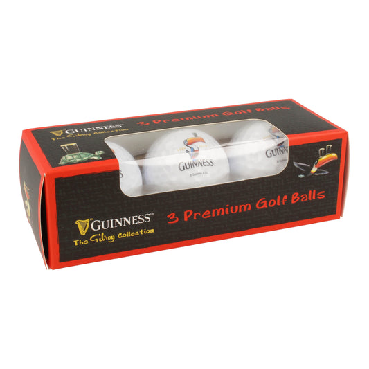 A box containing three premium Guinness Gilroy 3 Pack Golf Balls, featuring iconic John Gilroy artwork, with a clear front panel showcasing the balls inside from Guinness Webstore US.