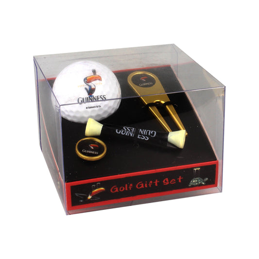 Introducing the Guinness Gilroy Golf Gift Set: a clear box containing a Guinness Webstore US-branded golf gift set, featuring John Gilroy artwork. Inside, you'll find a golf ball, tees, ball marker, and divot repair tool—a true collector's item for any golf enthusiast.